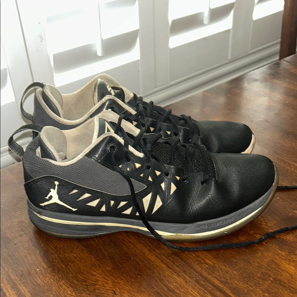 Nike Black and Gray Athletic Shoes with Distinctive Cut-Out Design